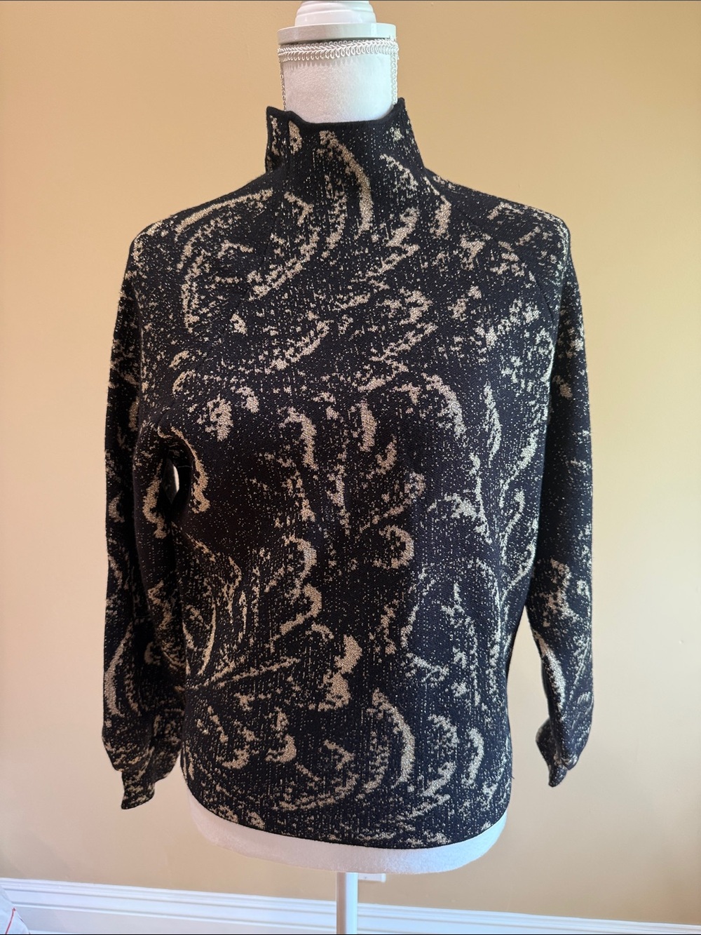 Anthropologie metallic mock neck top.